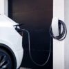 tesla wall connector plugged to a tesla car