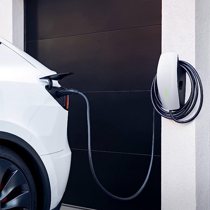 tesla wall connector plugged to a tesla car
