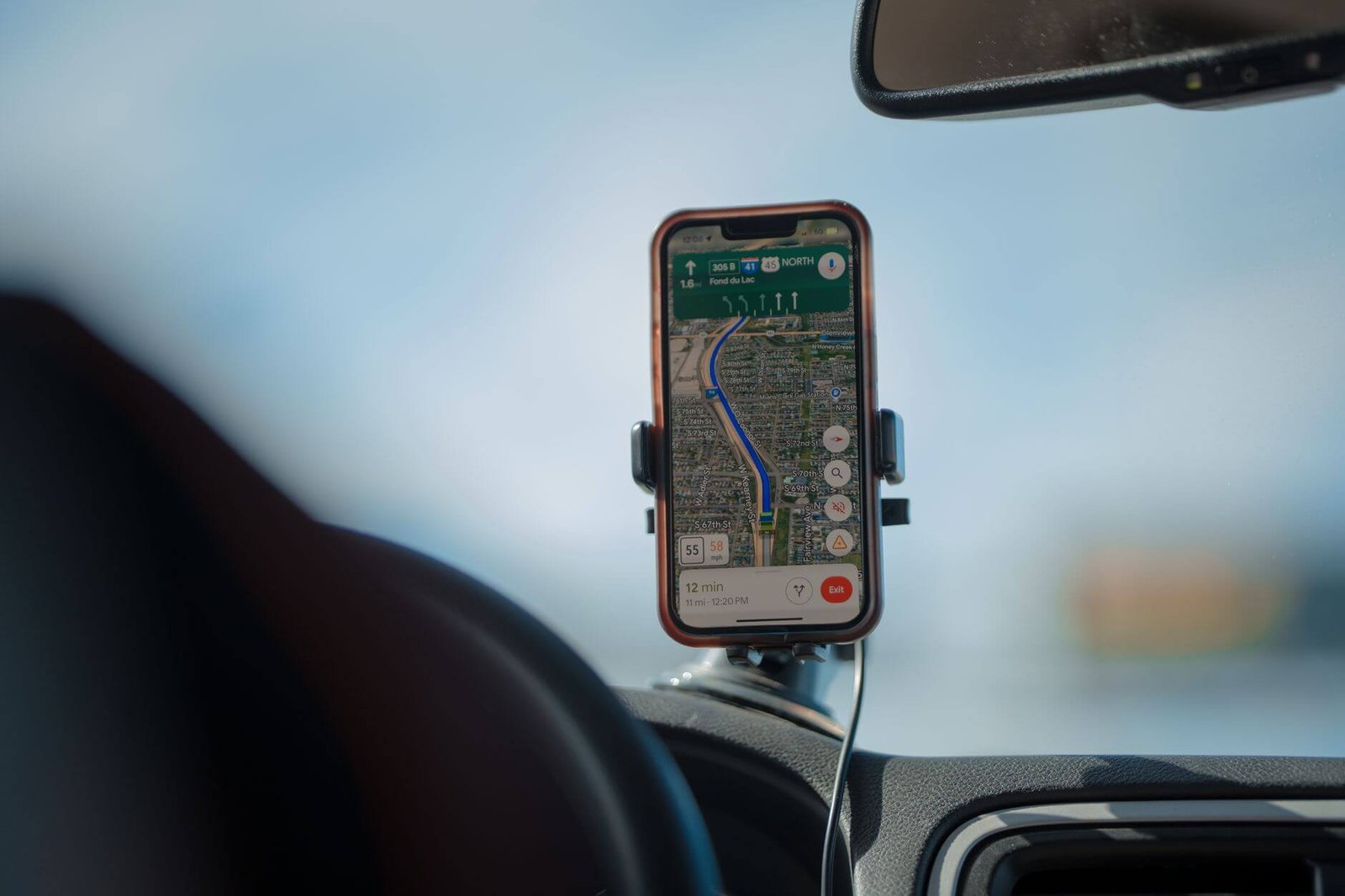 Using a phone mount, one of the most useful Tesla Model 3 Highland accessories